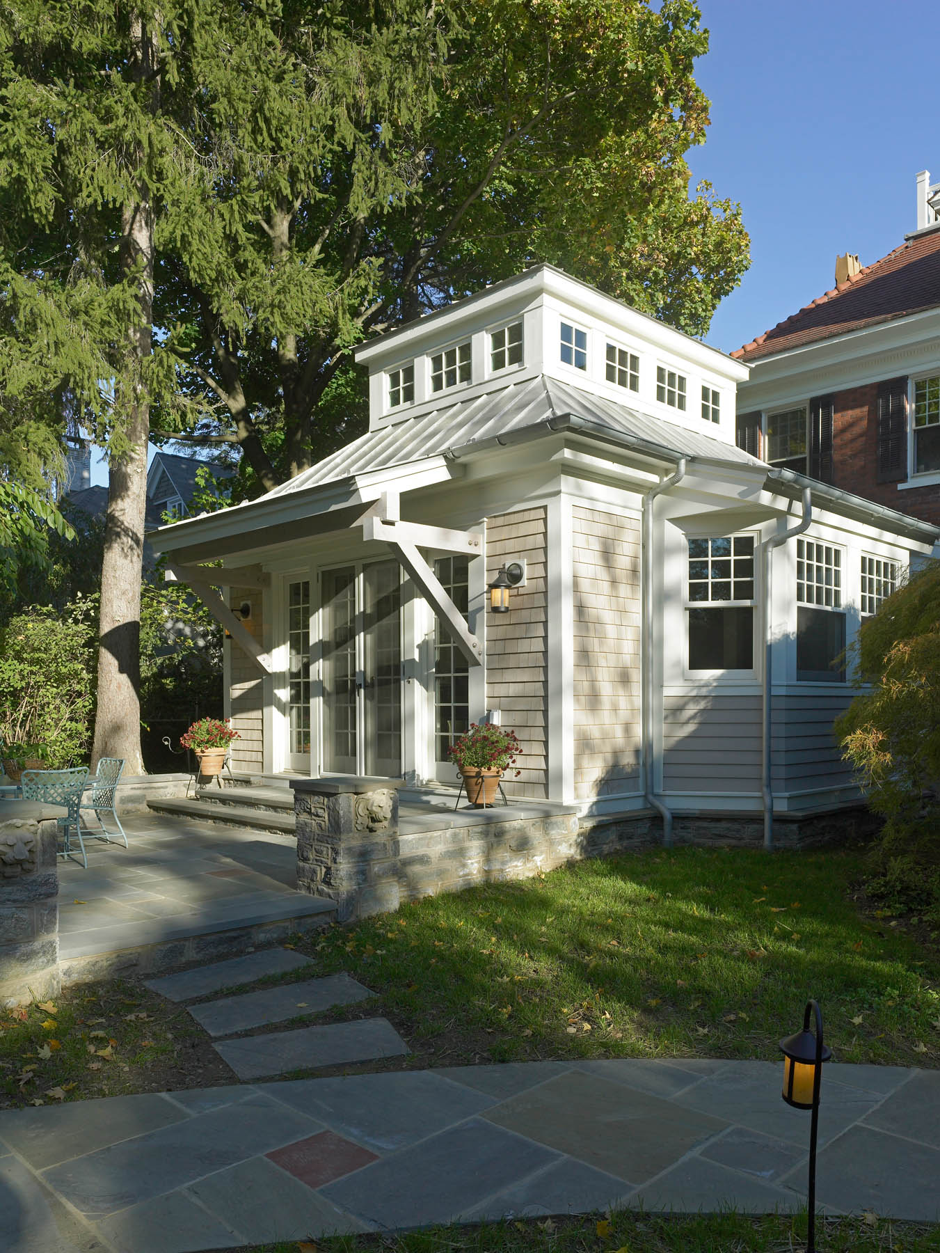 Cedar shingle addition with bay window