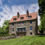 rear view of grand old stone house after renovation