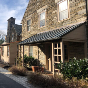 New addition on renovated stone house exterior view