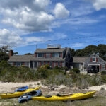 Vacation home with kayaks on beach